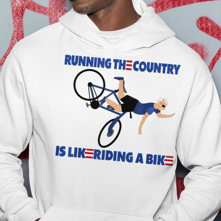Running The Coutry Is Like Riding A Bike Joe Biden Funny Running Funny Gifts Hoodie Unique Gifts
