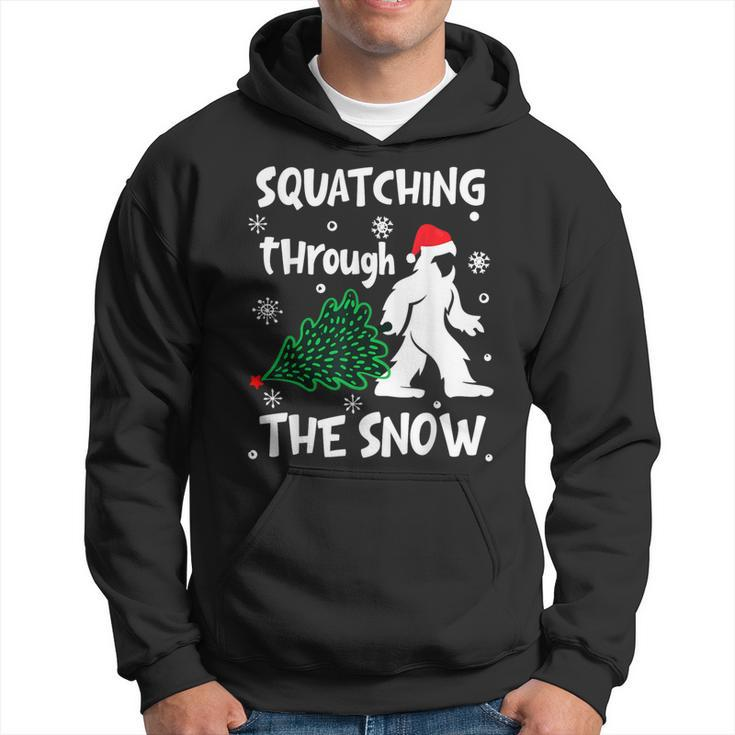 Squatching Through The Snow Christmas Sasquatch Santa Hat Hoodie