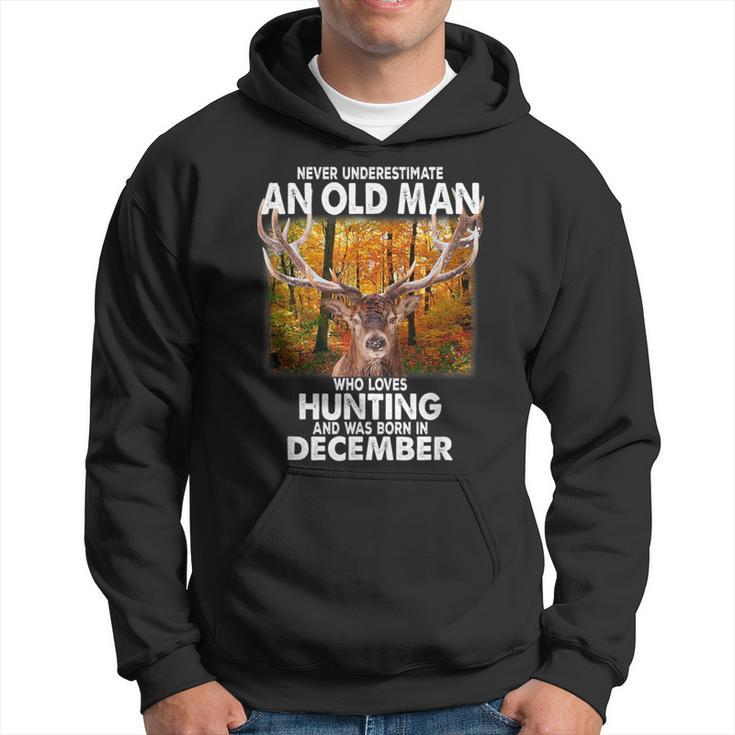 Never Underestimate A Man Loves Hunting Born In December Hoodie