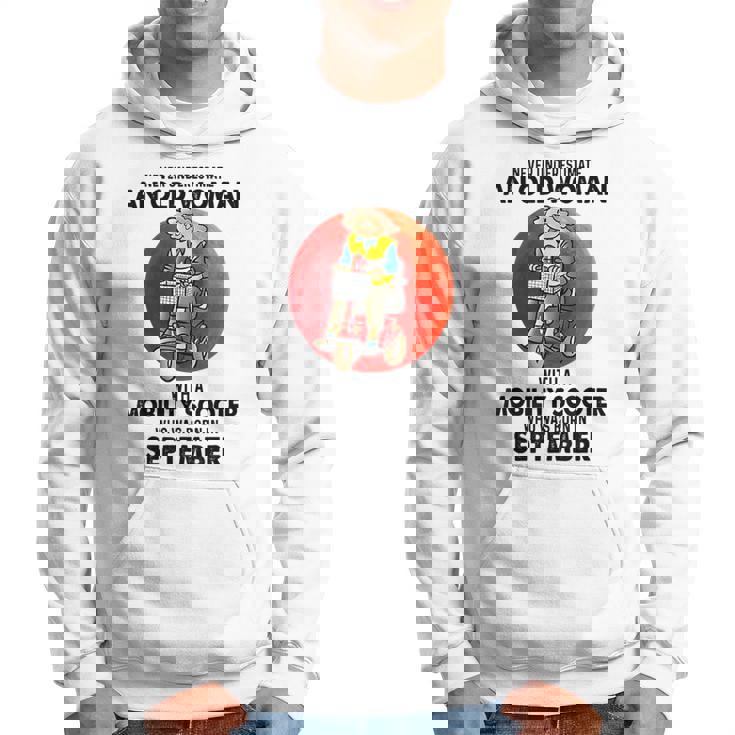 Never Underestimate An Old Woman Mobility Scooter September Old Woman Funny Gifts Hoodie