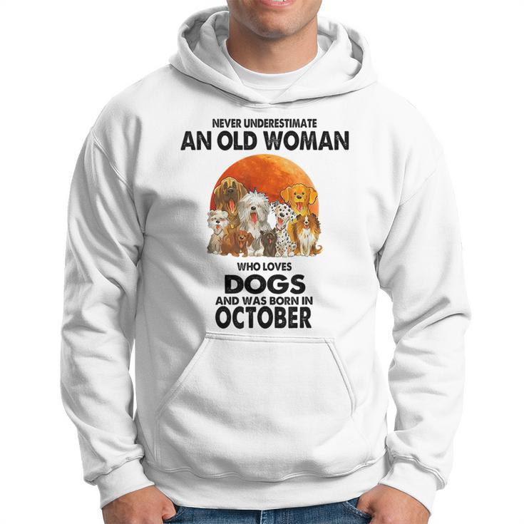 Never Underestimate An Old Woman Who Loves Dogs Born October Old Woman Funny Gifts Hoodie