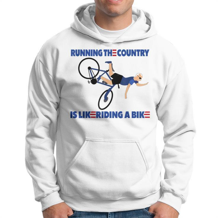 Running The Coutry Is Like Riding A Bike Joe Biden Funny Running Funny Gifts Hoodie