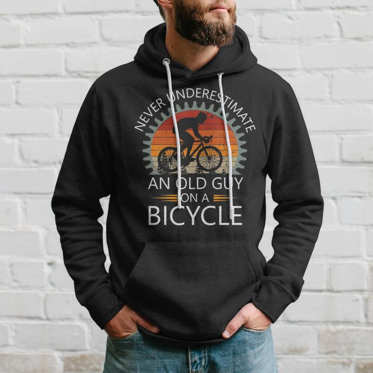 An Old Guy On A Bicycle Cycling Vintage Never Underestimate Cycling Funny Gifts Hoodie Gifts for Him