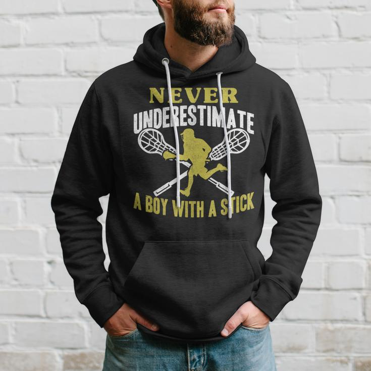 Never Underestimate A Boy With A Stick Lax Player Lacrosse Lacrosse Funny Gifts Hoodie Gifts for Him