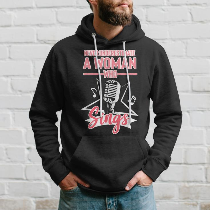 Never Underestimate A Woman Who Sings Lead Singer Singing Singer Funny Gifts Hoodie Gifts for Him