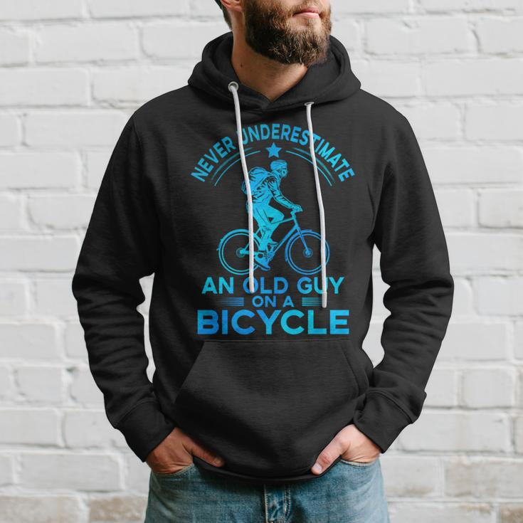 Never Underestimate An Old Guy On A Bicycle Nice Cycling Hoodie Gifts for Him