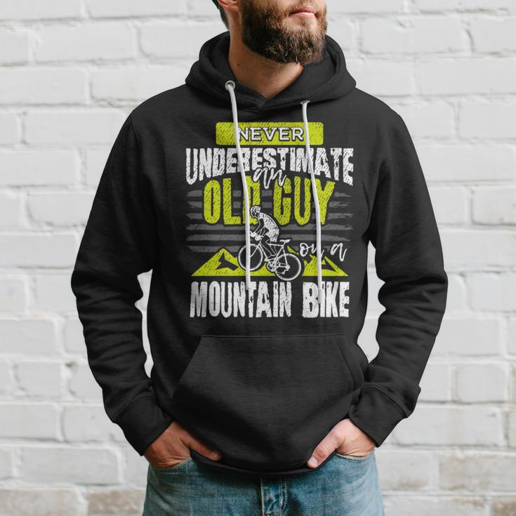 Never Underestimate An Old Guy On A Mountain Bike Cycling Cycling Funny Gifts Hoodie Gifts for Him