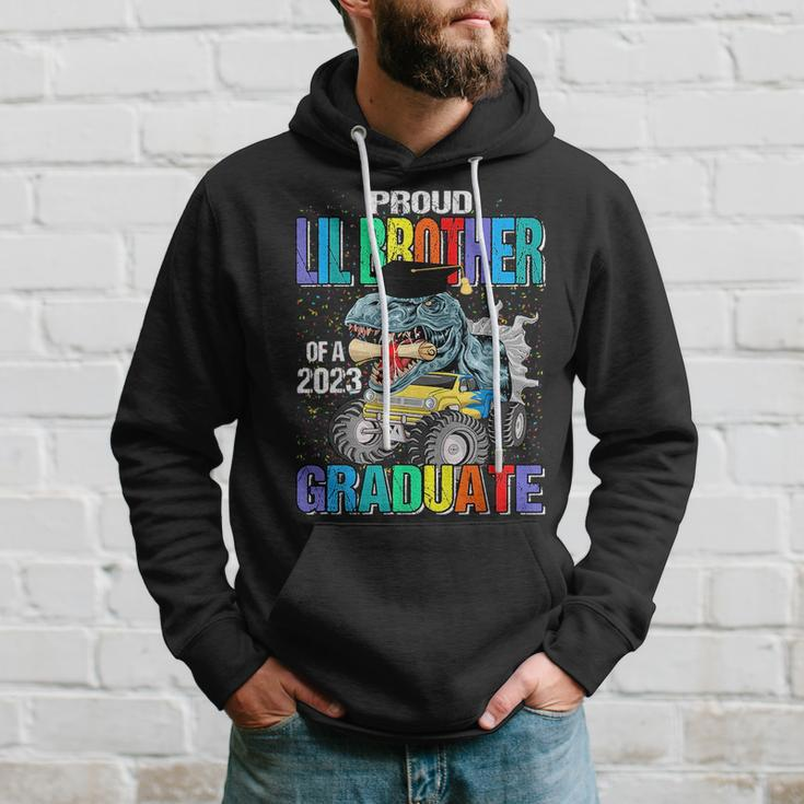 Proud Lil Brother Of A 2023 Graduate Monster Truck Dinosaur Hoodie Gifts for Him