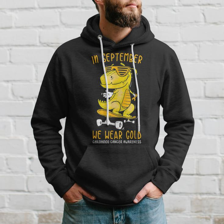 In September We Wear Gold Childhood Cancer Awareness T-Rex Hoodie Gifts for Him