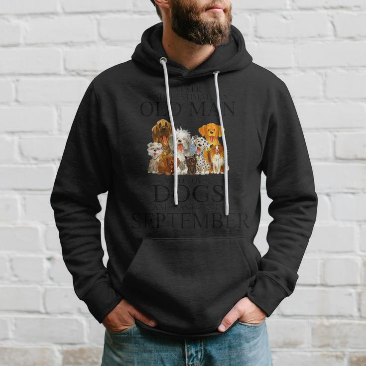 Never Underestimate An Old Man Who Loves Dogs In September Hoodie Gifts for Him