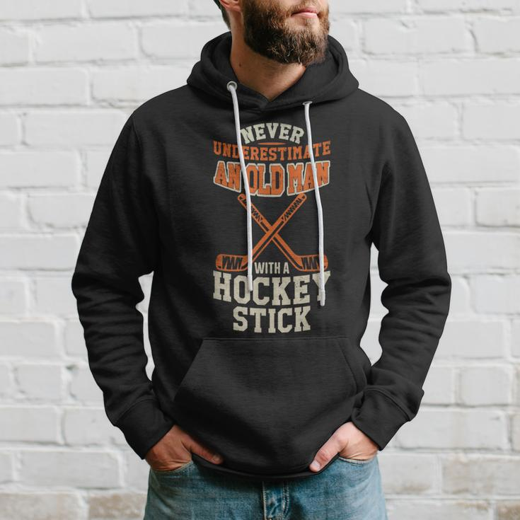 Never Underestimate An Old Man With A Stick Old Man Hockey Hoodie Gifts for Him