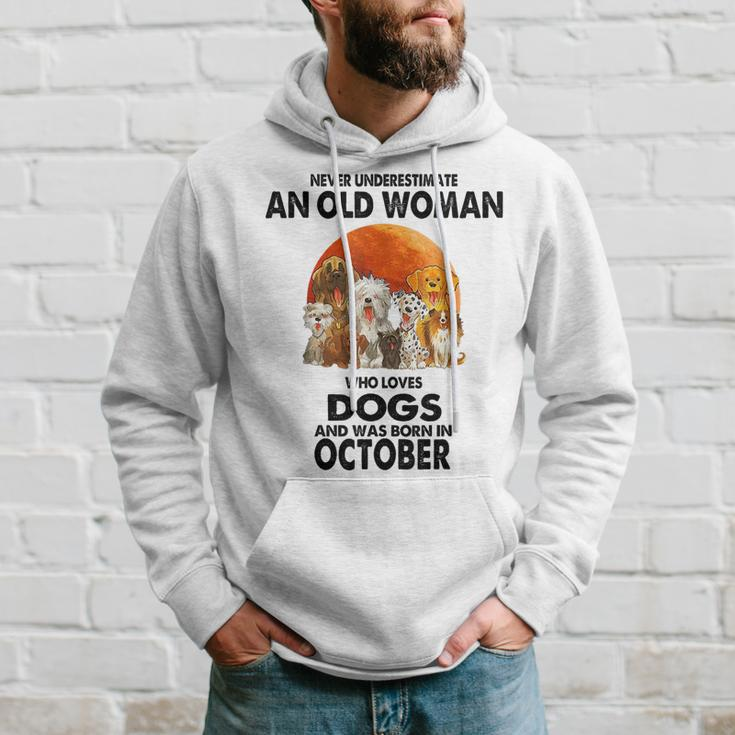 Never Underestimate An Old Woman Who Loves Dogs Born October Old Woman Funny Gifts Hoodie Gifts for Him