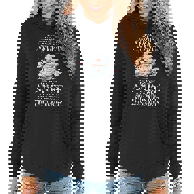 Never Underestimate A Woman Who Is Also A Nurse December Women Hoodie