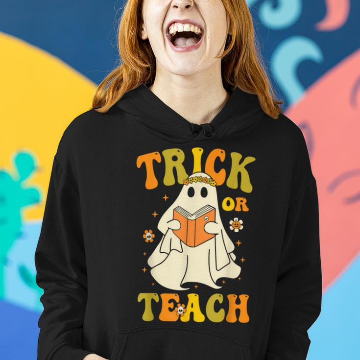 Trick Or Teach Groovy Halloween Retro Floral Ghost Teacher Women Hoodie Gifts for Her