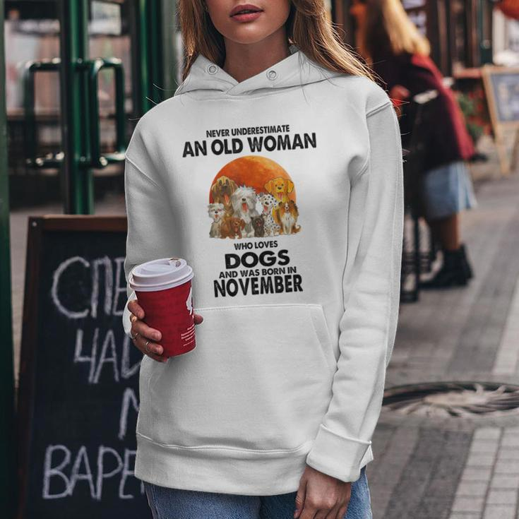 Never Underestimate An Old Woman Who Loves Dogs November Women Hoodie Personalized Gifts