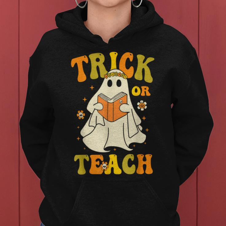 Trick Or Teach Groovy Halloween Retro Floral Ghost Teacher Women Hoodie
