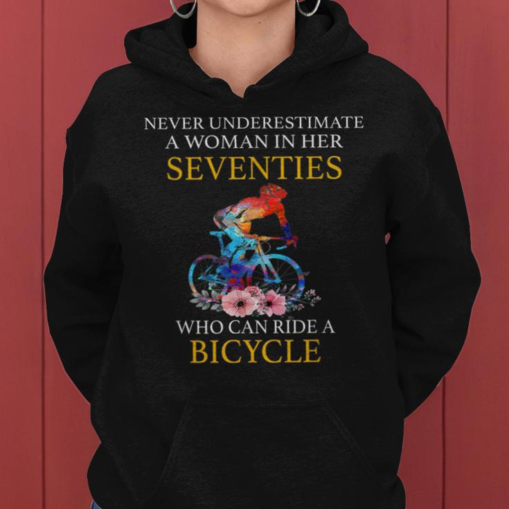 Never Underestimate Woman In Her Seventies Rides A Bicycle Women Hoodie