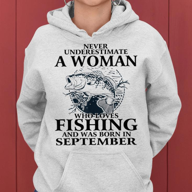 Never Underestimate Awoman Who Loves Fishing -September Women Hoodie