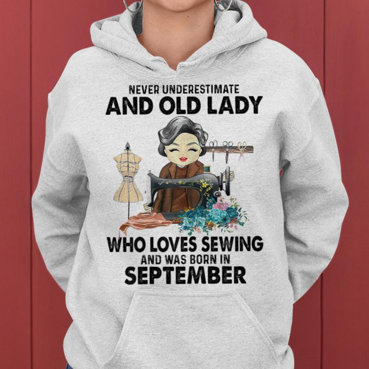 Never Underestimate Old Lady Loves Sewing & Born In Women Hoodie