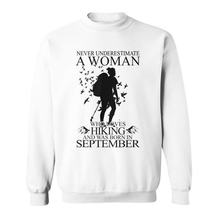Never Underestimate A Woman Who Loves Hiking September Sweatshirt