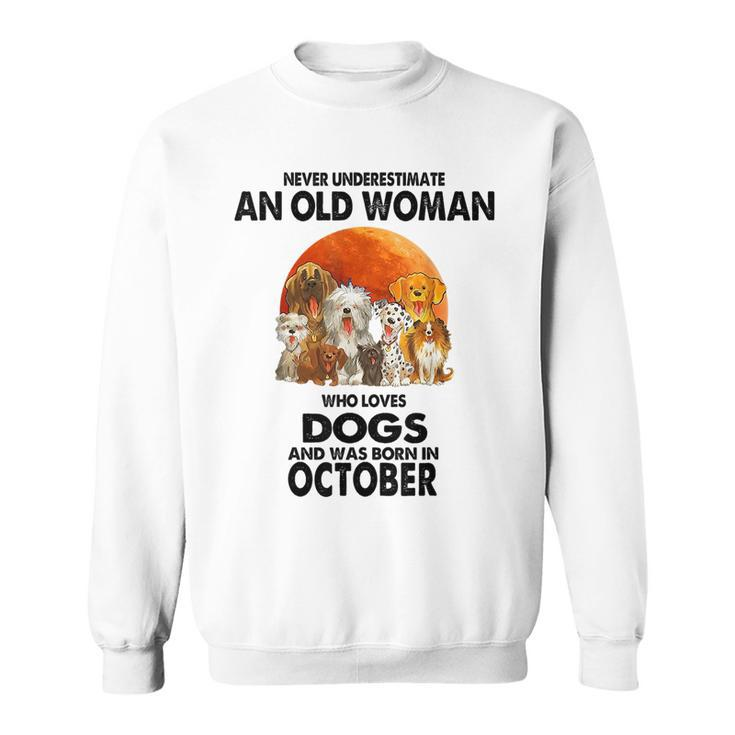 Never Underestimate An Old Woman Who Loves Dogs Born October Old Woman Funny Gifts Sweatshirt
