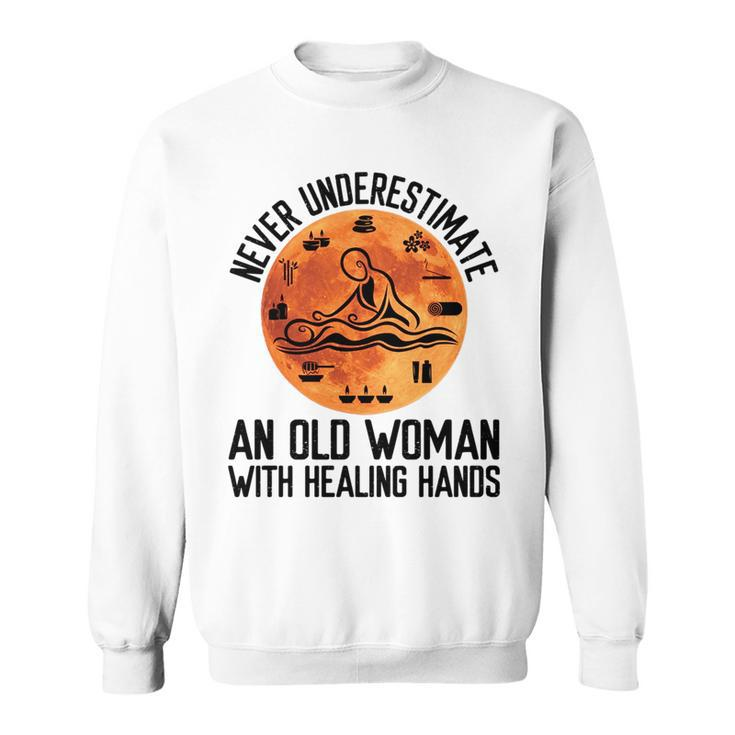 Never Underestimate An Old Woman With Healing Hands Old Woman Funny Gifts Sweatshirt