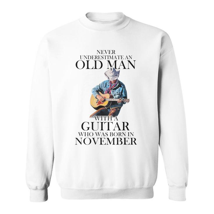 Never Underestimate A November Man With A Guitar Sweatshirt