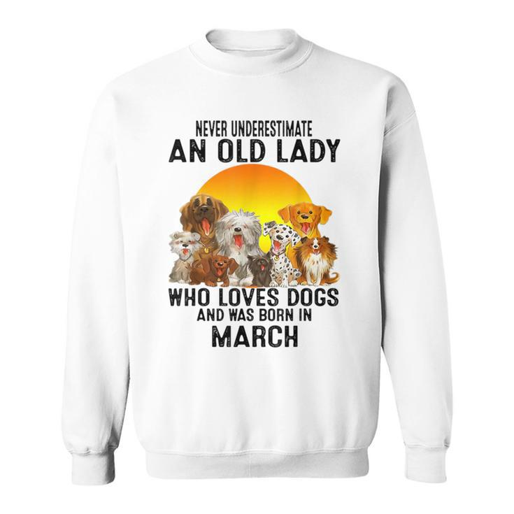 Never Underestimate An Old March Lady Who Loves Dogs Pet Sweatshirt