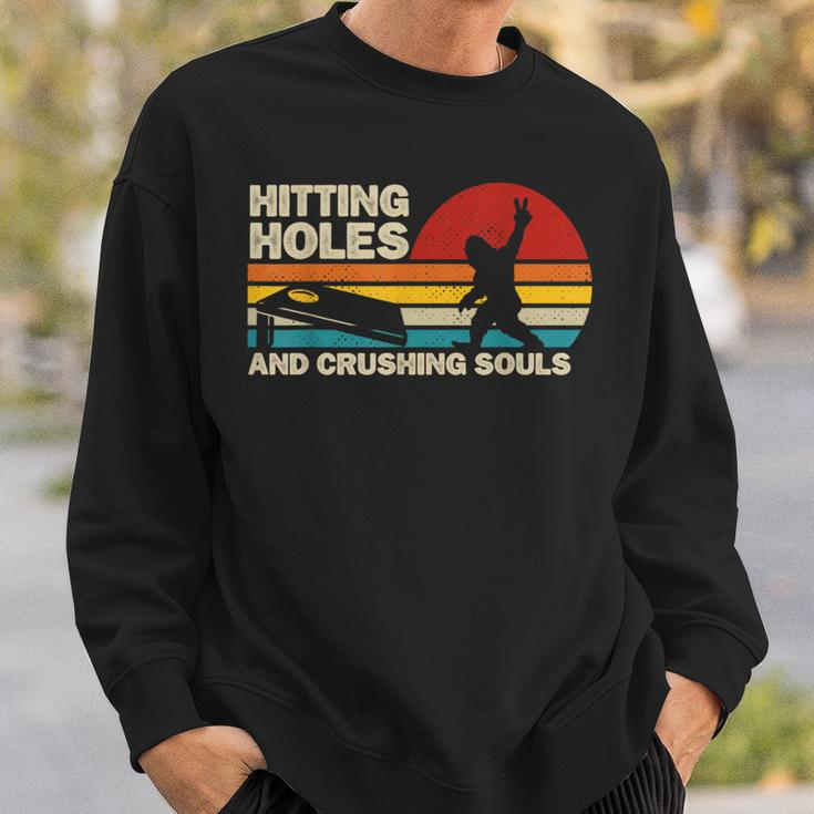 Hitting Holes And Crushing Souls Bigfoot Cornhole Sweatshirt Gifts for Him