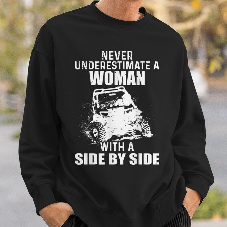 Never Underestimate A Woman With A Side By Side Sweatshirt Gifts for Him