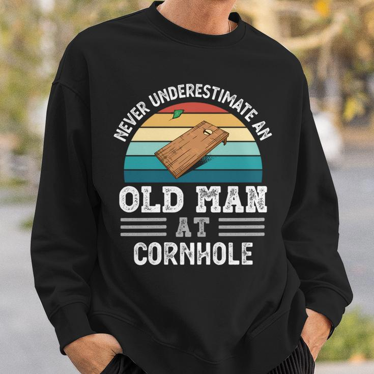 Never Underestimate An Old Man At Cornhole Fathers Day Sweatshirt Gifts for Him