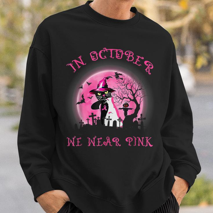 In October We Wear Pink Cat Witch Breast Cancer Halloween Sweatshirt Gifts for Him