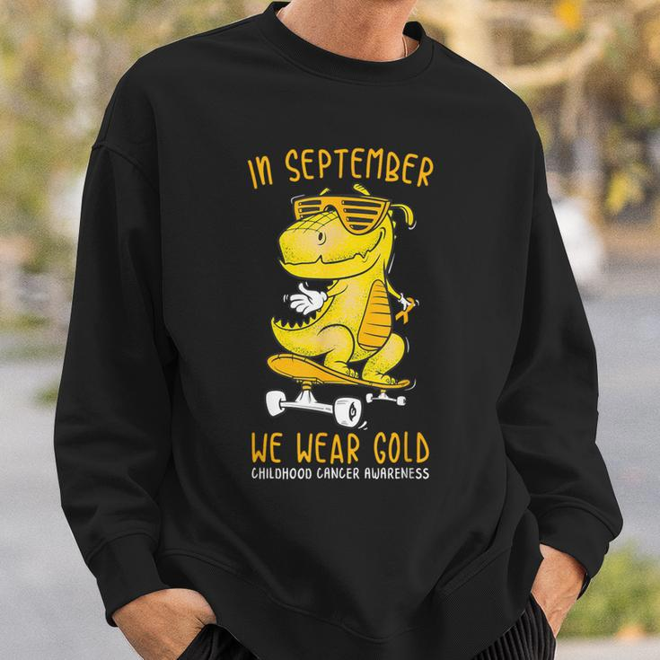 In September We Wear Gold Childhood Cancer Awareness T-Rex Sweatshirt Gifts for Him