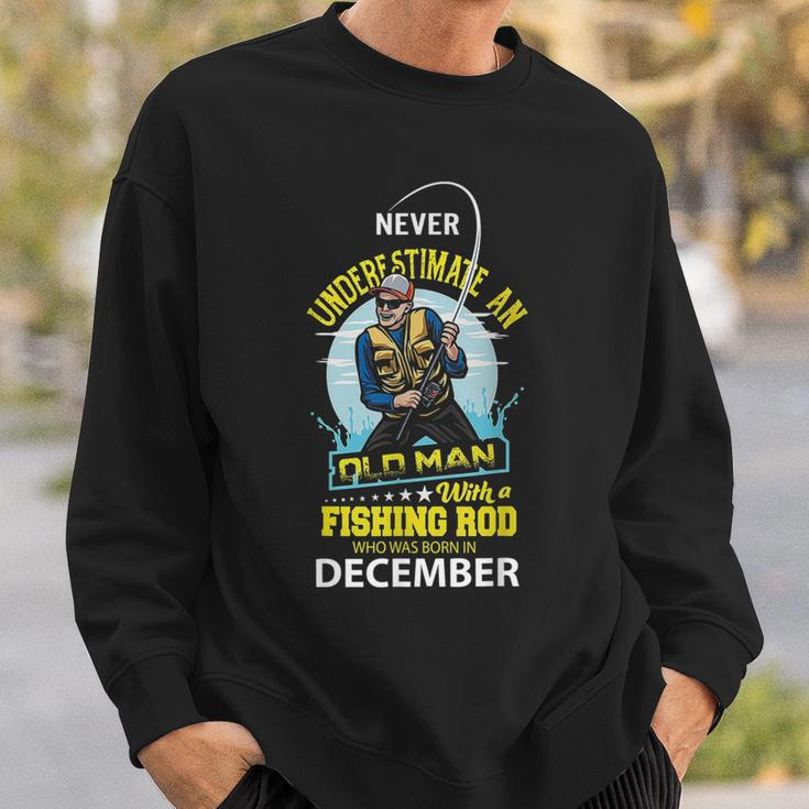 Never Underestimate Old Man With A Fishing Rod Born In Dec Sweatshirt Gifts for Him
