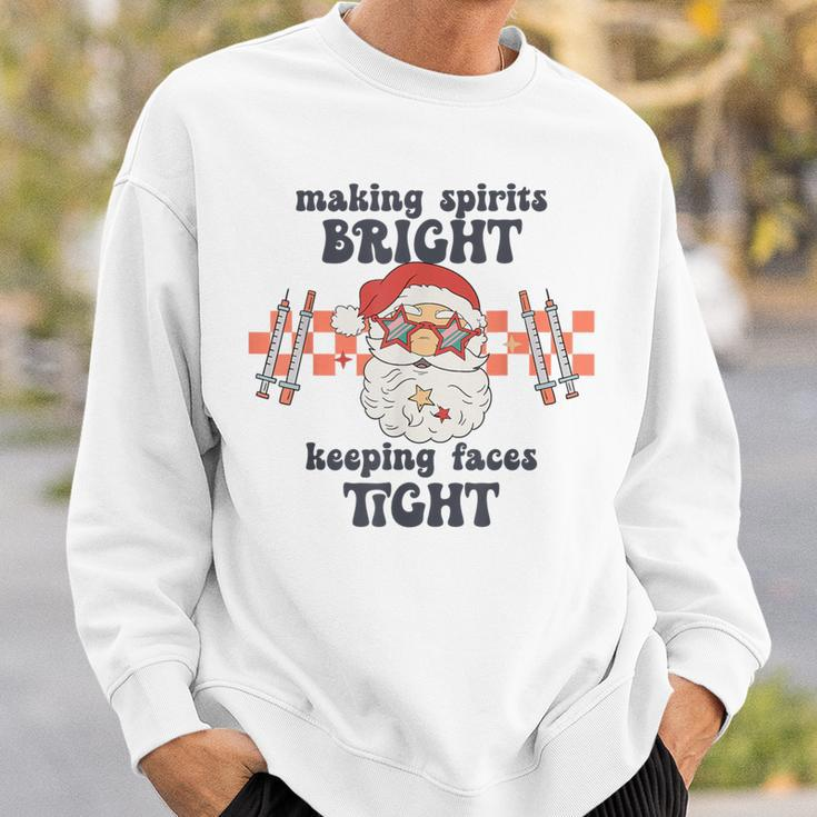 Making Spirits Bright Keeping Faces Tight Santa Christmas Sweatshirt Gifts for Him