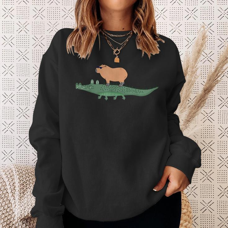 Funny Capybara Riding On A Crocodile Sweatshirt Gifts for Her