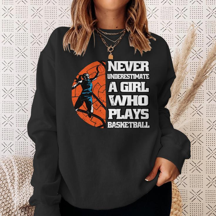 Never Underestimate A Girl Who Plays Basketball Sport Lover Sweatshirt Gifts for Her