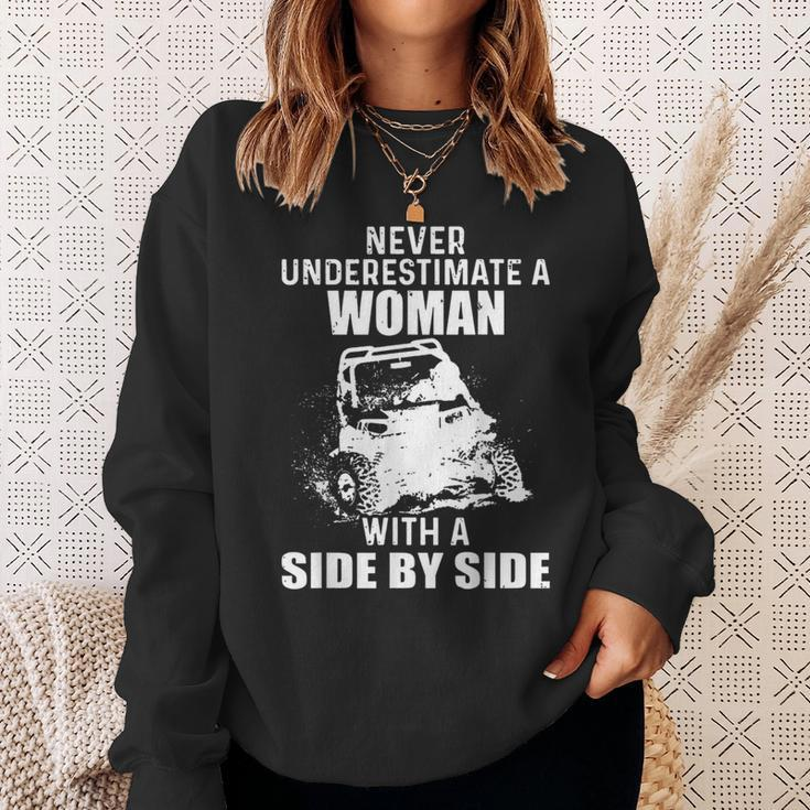 Never Underestimate A Woman With A Side By Side Sweatshirt Gifts for Her