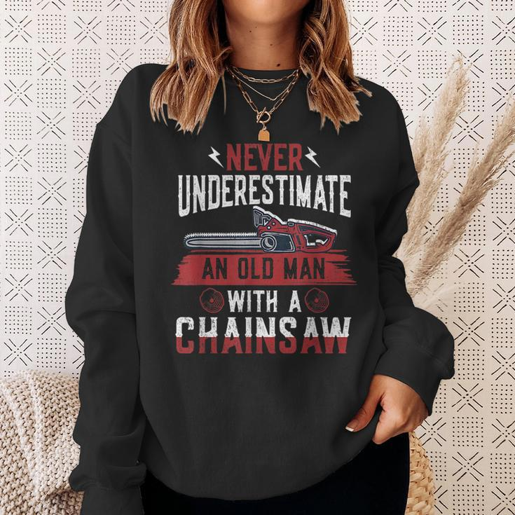 Never Underestimate An Old Man Chainsaw Lumberjack Sweatshirt Gifts for Her