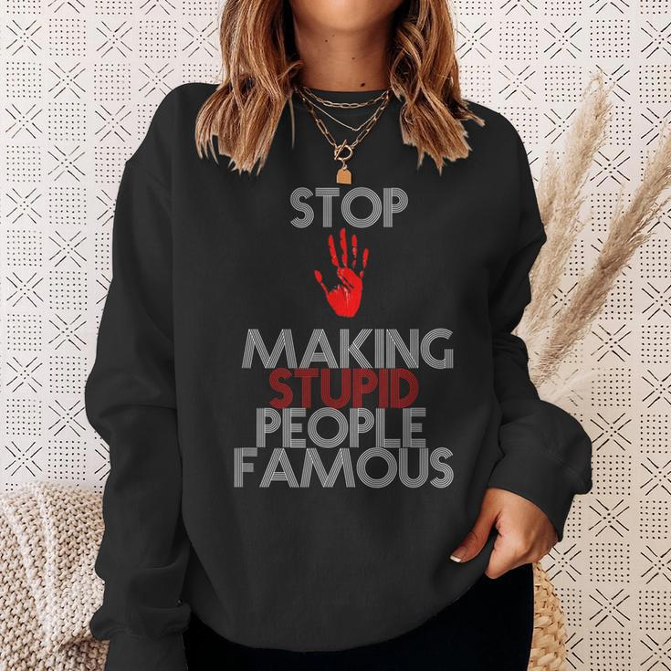 Stop Making The Stupid People Famous Funny Sweatshirt Gifts for Her