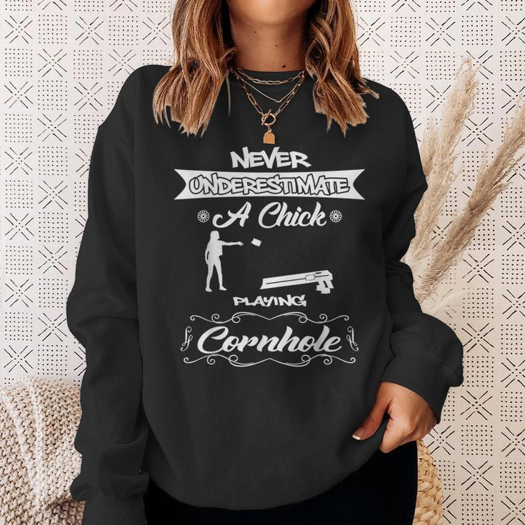 Never Underestimate A Chick Playing Cornhole Sweatshirt Gifts for Her