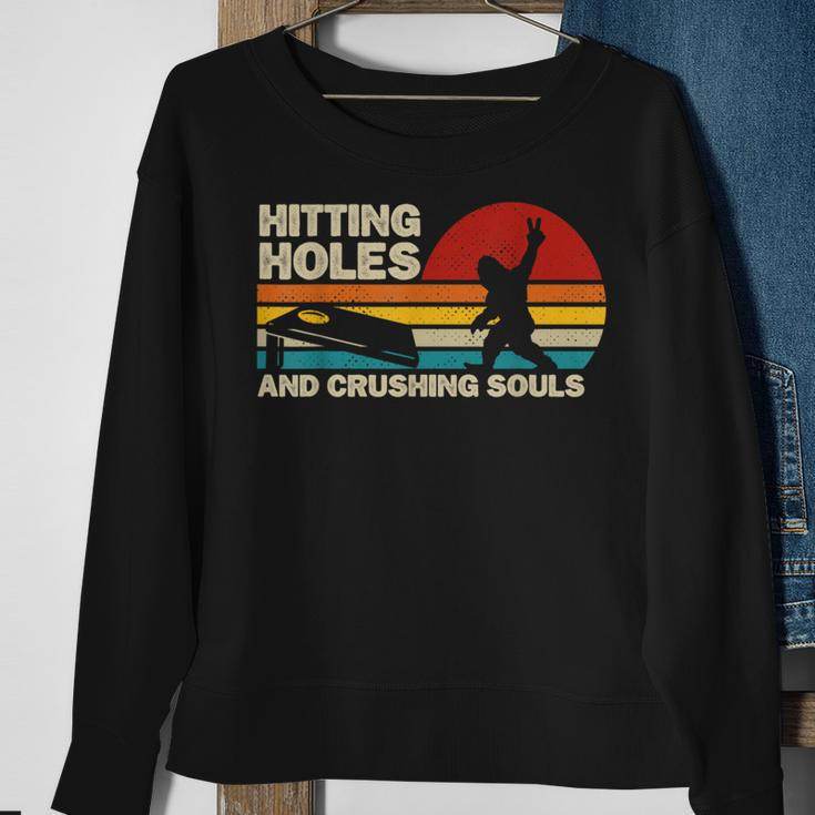 Hitting Holes And Crushing Souls Bigfoot Cornhole Sweatshirt Gifts for Old Women