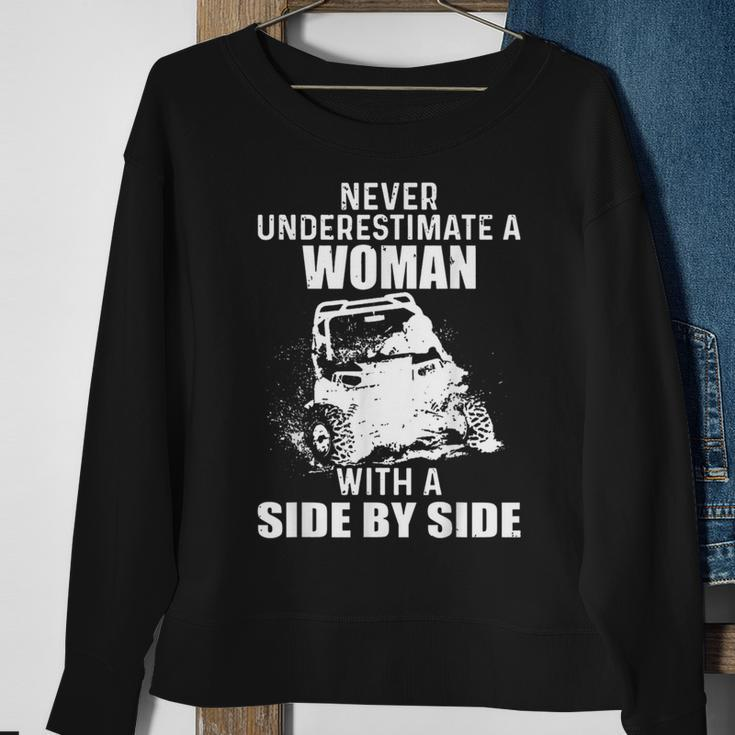 Never Underestimate A Woman With A Side By Side Sweatshirt Gifts for Old Women