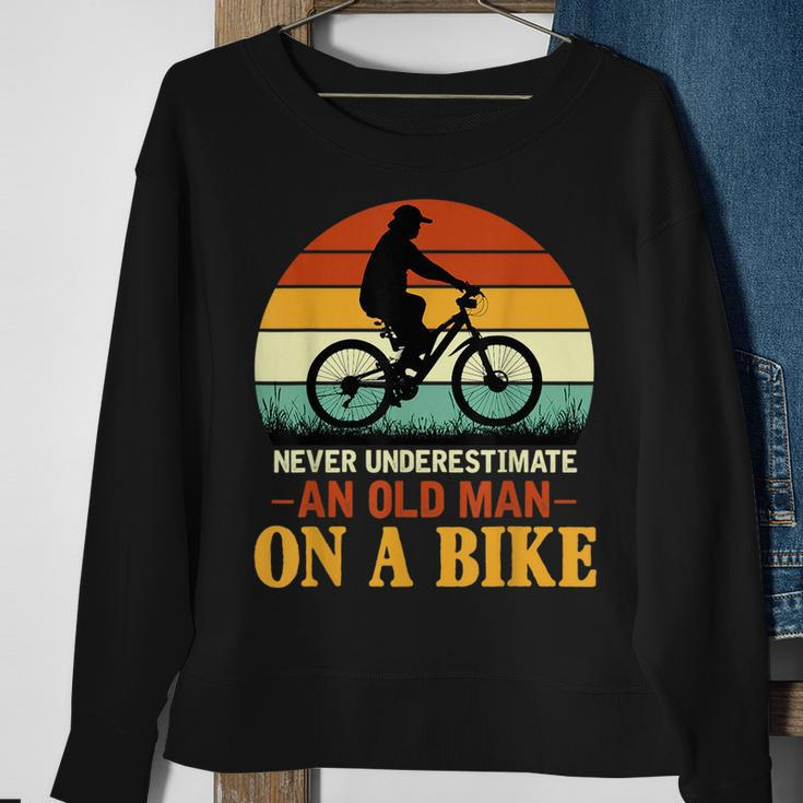 Never Underestimate Funny Quote An Old Man On A Bicycle Retr Sweatshirt Gifts for Old Women