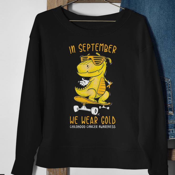 In September We Wear Gold Childhood Cancer Awareness T-Rex Sweatshirt Gifts for Old Women