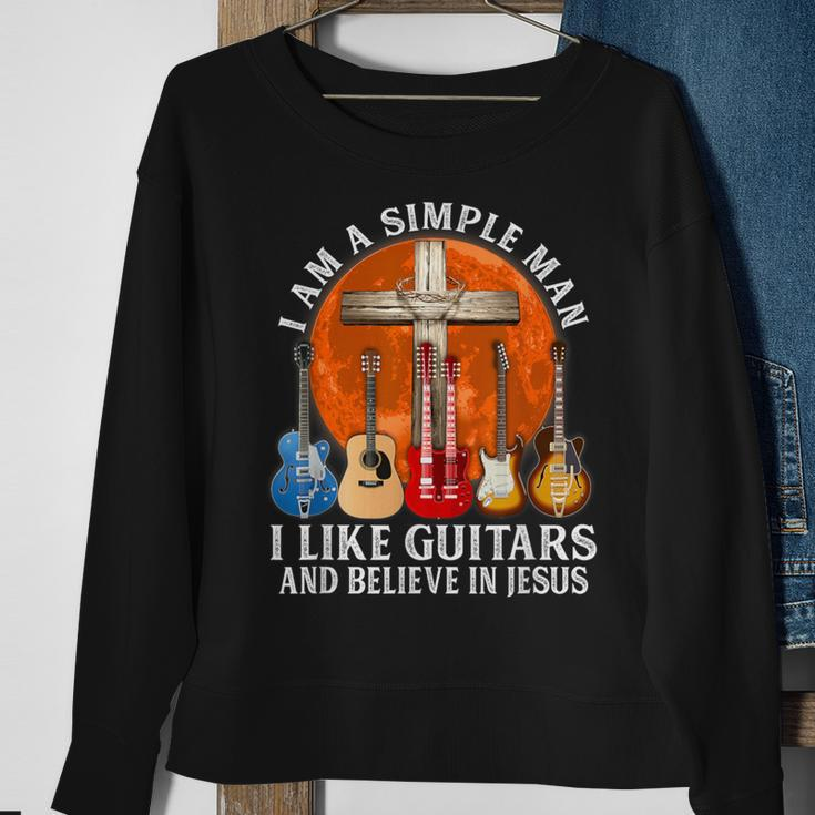 I Am A Simple Man I Like Guitars And Believe In Jesus Sweatshirt Gifts for Old Women