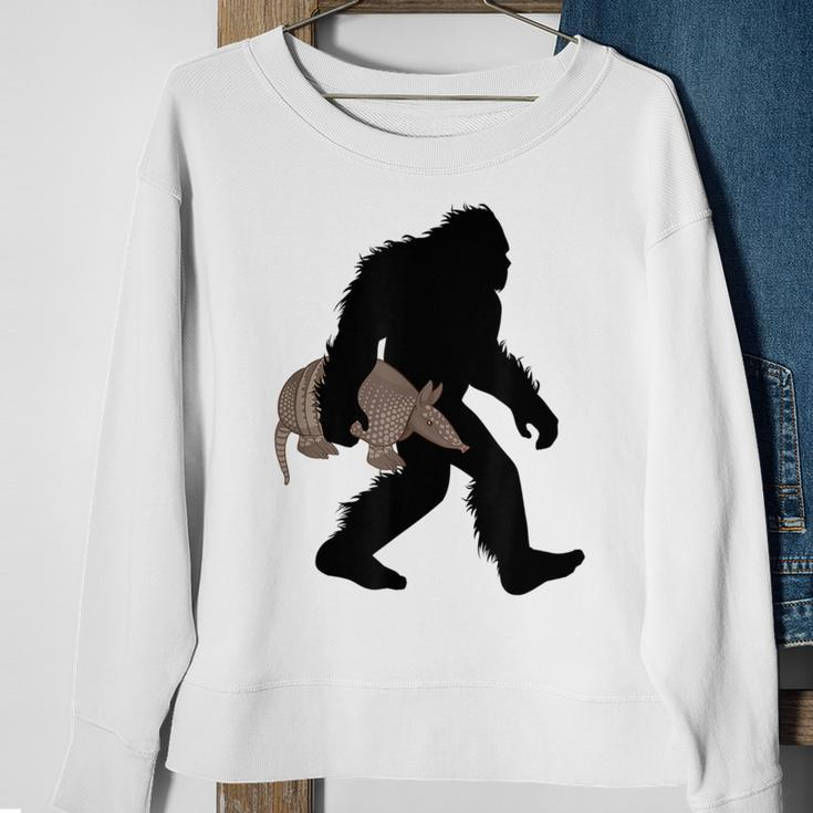 Bigfoot Cradling Armadillo Cryptid Sasquatch Sweatshirt Gifts for Old Women