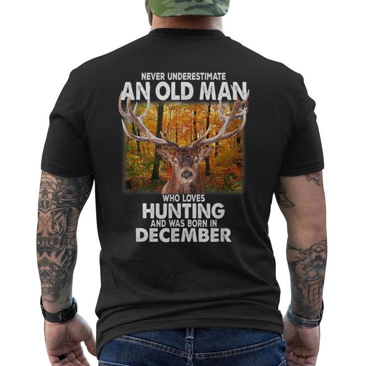 Never Underestimate A Man Loves Hunting Born In December Men's T-shirt Back Print