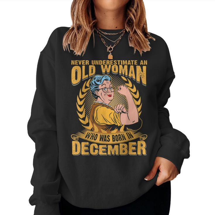 Never Underestimate An Old Woman Who Born In December Women Sweatshirt