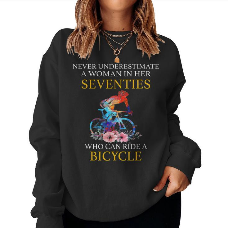 Never Underestimate Woman In Her Seventies Rides A Bicycle Women Sweatshirt